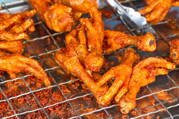 Deep fried chicken feet on the local market in Thailand