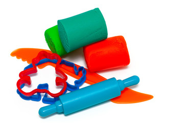 colourful molding dough and cutters for children isolated on whi