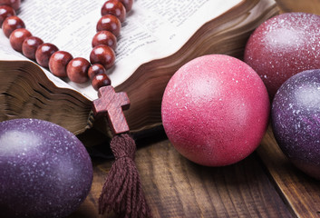 decorated with painted Easter eggs and an open bible