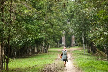 Fototapeta premium Woman walking in forest