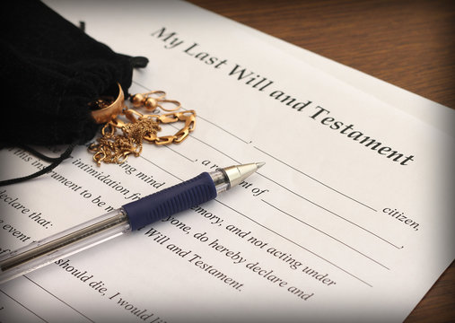 Last Will and Testament form with gold jewelry
