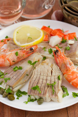 boiled fish with seafood ans lemon