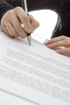 Business woman signing a contract