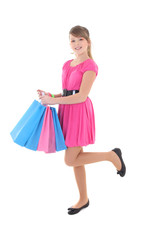 happy teenage girl in pink with shopping bags