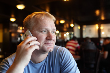 Man calling from cafe