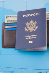American passport and wallet with dollars cash and credit cards