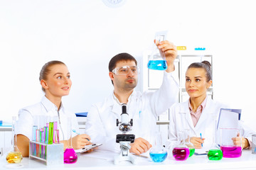 Team of scientists working in laboratory