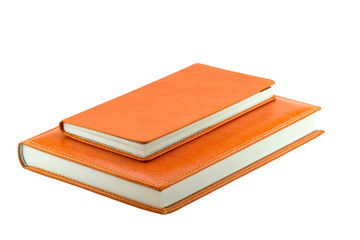 Two orange notebook. A big and a small