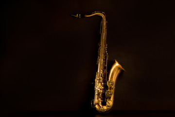 Sax golden tenor saxophone in black - obrazy, fototapety, plakaty