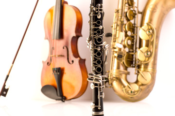 Sax tenor saxophone violin and clarinet in white