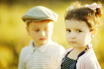 little serious girl and boy