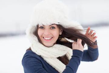 Winter young woman in wind