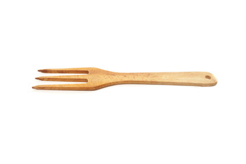 Wooden kitchen fork isolated on white background