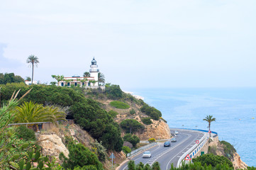 Lighthouse and road on Costa Brava coast.