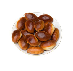 Plate with pastry (piroshki). Isolated.