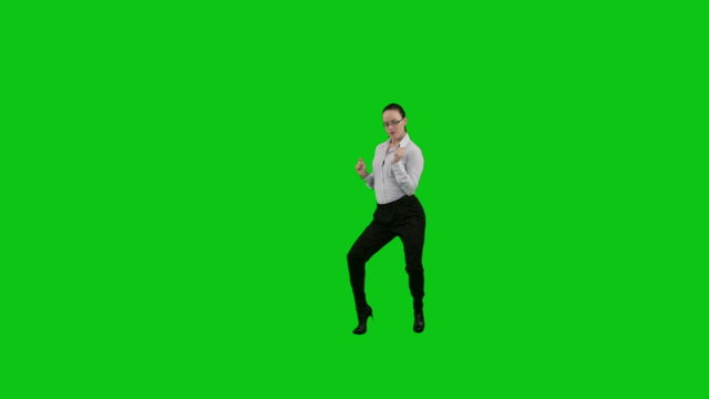 Business woman dances. Green screen.