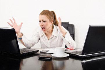 Business woman multitasking and frustrated by modern technology