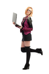 Girl with laptop standing on a white background.
