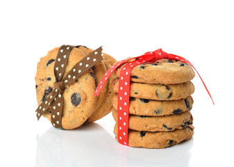 Cookies decorated with ribbons on white background