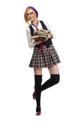 Girl with books standing on a white background