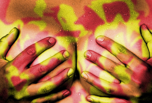 Hands covering breasts