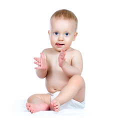 Nine month boy applauding, on white background.