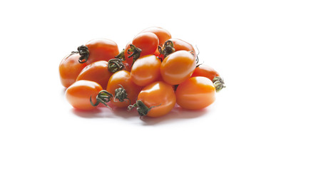 Yellow tomatoes on white background