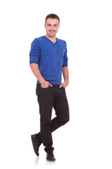 Fototapeta premium young man standing with hands in pockets