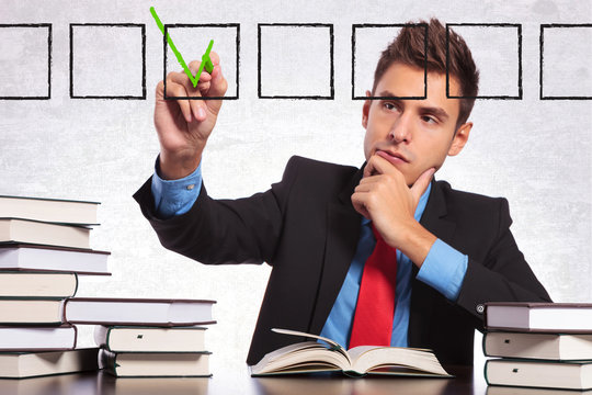 business man checking a list of books he read