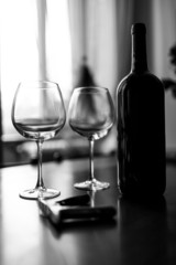 Glasses and wine bottle B&W image