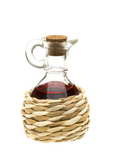 Small decanter with red wine vinegar isolated on the white