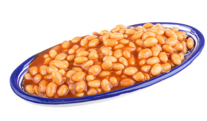 Marinated haricot beans in tomato sauce with shallots on a plate