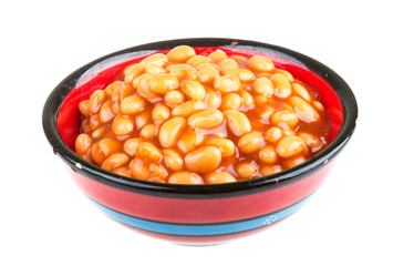 Marinated haricot beans in tomato sauce with shallots on a plate
