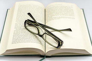 Glasses over book