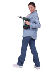 sexy craftswoman holding a drill