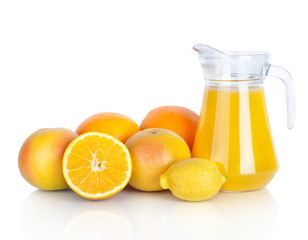 Jug of orange juice and citrus fruits isolated on white