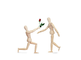 Wooden model handing over love gift to friend on Valentine day