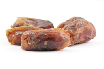 dried dates isolated on white