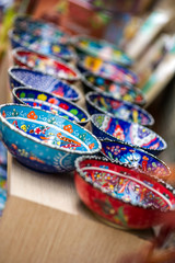 Small colorful pottery bowls in a row