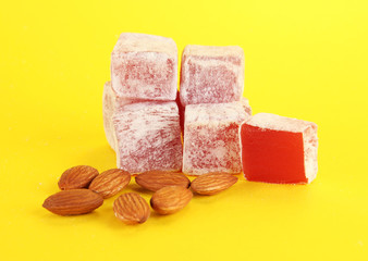 rahat lokum and nuts on yellow background