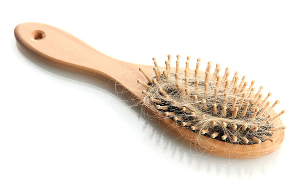 comb brush with lost hair, isolated on white