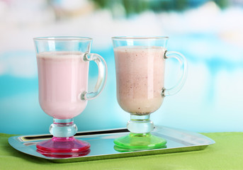 Cream cocktails on brightblue background