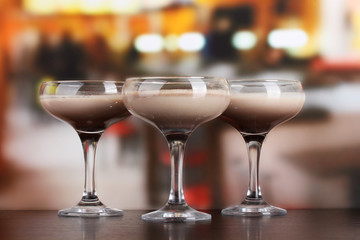 Cream cocktails on table in cafe