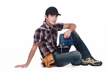 Tradesman holding a jigsaw