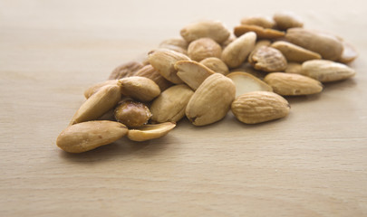 Fried almonds isolated over white background