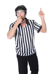 Portrait of hockey judge whistling