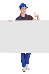 Smiling Female Plumber Holding Placard