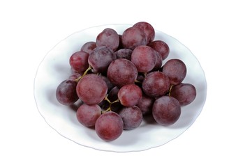 Red grapes on white plate © Arena Photo UK