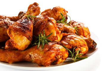 Grilled chicken legs on white background