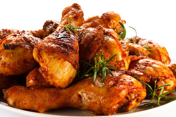 Grilled chicken legs on white background